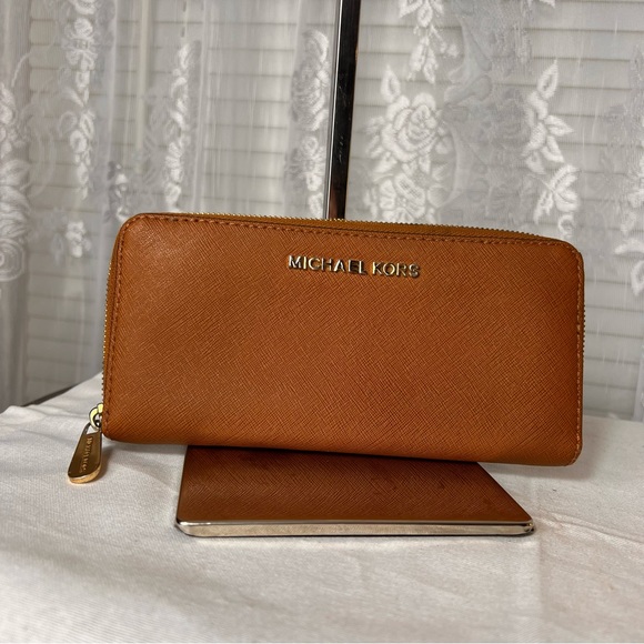 Michael Kors Handbags - Authentic Michael Kors Genuine Saffiano British Tan Leather Zippy Long Wallet